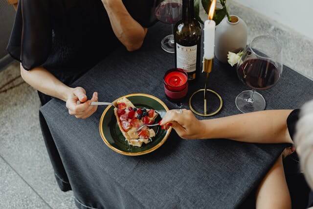 Couple having dessert with wine